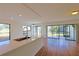 Modern white kitchen with stainless steel appliances and a breakfast bar at 4668 Tower Pine Rd # Ge, Orlando, FL 32839