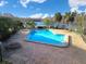 Relaxing community pool with lounge chairs at 4668 Tower Pine Rd # Ge, Orlando, FL 32839