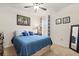 Bright bedroom with a full bed, window, and mirrored closet at 4861 Panga Ave, Mount Dora, FL 32757