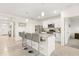 Kitchen with white cabinets, granite island, and stainless steel appliances at 4861 Panga Ave, Mount Dora, FL 32757