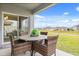 Patio with wicker dining set and view of the backyard at 4861 Panga Ave, Mount Dora, FL 32757