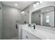 Modern bathroom with a frameless shower and quartz countertop at 51 Aspen Rd, Ocala, FL 34480