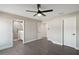 Bedroom with ceiling fan and en-suite bathroom at 51 Aspen Rd, Ocala, FL 34480