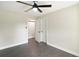 Spacious bedroom with ceiling fan, wood-look floors and a large closet at 51 Aspen Rd, Ocala, FL 34480