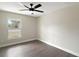 Bright bedroom with hardwood floors and large window at 51 Aspen Rd, Ocala, FL 34480