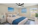 Spacious bedroom with hardwood floors, ceiling fan and large windows at 51 Aspen Rd, Ocala, FL 34480