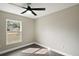 Bright bedroom featuring a ceiling fan and laminate wood flooring at 51 Aspen Rd, Ocala, FL 34480