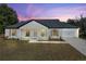 Charming single-story house with gray roof and white exterior at 51 Aspen Rd, Ocala, FL 34480
