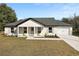 Newly built single story home with a gray roof and white siding at 51 Aspen Rd, Ocala, FL 34480