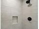Clean shower with beige tiles and black fixtures at 51 Aspen Rd, Ocala, FL 34480