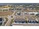 Aerial view of townhome community near main roads and businesses at 5369 Pinecone Ct, Wildwood, FL 34785