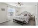 Spacious bedroom with a king-size bed and ensuite bathroom at 5369 Pinecone Ct, Wildwood, FL 34785