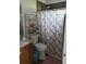 Bathroom with shower/tub combo and wood vanity at 540 E Minneola Ave, Clermont, FL 34711