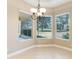 Bright breakfast nook with tile flooring and view of backyard at 6027 Spinnaker Loop, Lady Lake, FL 32159