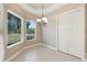 Bright breakfast nook with tile flooring and view of backyard at 6027 Spinnaker Loop, Lady Lake, FL 32159