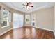 Bright dining room with hardwood floors and sliding glass doors at 6027 Spinnaker Loop, Lady Lake, FL 32159