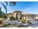 Single-story house with a two-car garage and well-maintained landscaping at 6027 Spinnaker Loop, Lady Lake, FL 32159