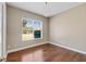 Bright office features hardwood floors, large window, and a chandelier at 6027 Spinnaker Loop, Lady Lake, FL 32159