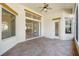 Spacious screened porch with tile flooring and sliding glass doors at 6027 Spinnaker Loop, Lady Lake, FL 32159