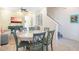 Dining area with a round table and chairs, adjacent to the living room at 8059 Knee Deep Rd, Kissimmee, FL 34747
