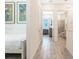 Hallway with light walls, tile floors, and access to bedrooms and bathrooms at 8059 Knee Deep Rd, Kissimmee, FL 34747