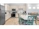 Well-equipped kitchen featuring stainless steel appliances and a dining area at 8059 Knee Deep Rd, Kissimmee, FL 34747