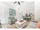 Open living space with a seating area, dining table, and kitchen area visible at 8059 Knee Deep Rd, Kissimmee, FL 34747