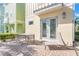 Private patio with seating area, adjacent to the home's exterior at 8059 Knee Deep Rd, Kissimmee, FL 34747