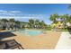 Sparkling community pool with surrounding patio and grass at 8059 Knee Deep Rd, Kissimmee, FL 34747