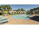 Inviting community pool area with turquoise chairs at 8059 Knee Deep Rd, Kissimmee, FL 34747