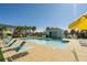 Community pool area with pool house and lounge chairs at 8059 Knee Deep Rd, Kissimmee, FL 34747