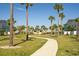 Paved walkway winds through a landscaped community at 8059 Knee Deep Rd, Kissimmee, FL 34747