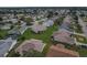 Community aerial view highlighting the neighborhood layout, landscaping, and residential properties at 8338 Se 178Th Deveaux Ln, The Villages, FL 32162