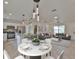 Open-concept living space with kitchen, dining area, and comfortable living room featuring modern décor at 8338 Se 178Th Deveaux Ln, The Villages, FL 32162