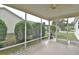 Relaxing screened-in patio with a ceiling fan at 8338 Se 178Th Deveaux Ln, The Villages, FL 32162