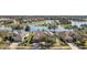 Aerial view of the property showing its location within a community near a scenic lake at 8920 Bridgeport Bay Cir, Mount Dora, FL 32757