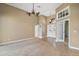 The living room features an open floor plan and high ceilings, creating a bright and airy space at 8920 Bridgeport Bay Cir, Mount Dora, FL 32757