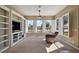 Bright living room features large windows, built in shelving, and views of the water at 8920 Bridgeport Bay Cir, Mount Dora, FL 32757