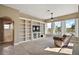 Living room features large windows, built in shelving, and an open floorplan at 8920 Bridgeport Bay Cir, Mount Dora, FL 32757