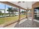Screened patio with brick floor and lake view at 8920 Bridgeport Bay Cir, Mount Dora, FL 32757