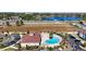 Community pool and spa with surrounding landscaping and parking at 8988 Silver Pl, Kissimmee, FL 34747