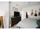 Main bedroom with dresser, TV, and guitars at 8988 Silver Pl, Kissimmee, FL 34747
