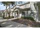 Townhouse exterior with walkway and landscaping at 8988 Silver Pl, Kissimmee, FL 34747
