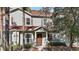 Two-story townhome with light gray siding, brown roof, and landscaping at 8988 Silver Pl, Kissimmee, FL 34747