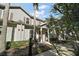 Townhome exterior with gray siding and landscaping at 8988 Silver Pl, Kissimmee, FL 34747