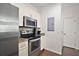 Kitchen with stainless steel appliances and granite countertops at 8988 Silver Pl, Kissimmee, FL 34747