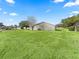 Large backyard with lush green grass at 9897 Se 178Th Pl, Summerfield, FL 34491