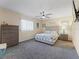 Bedroom with dresser and ceiling fan at 9897 Se 178Th Pl, Summerfield, FL 34491