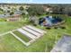 Community bocce ball courts near a pond and gazebo at 9897 Se 178Th Pl, Summerfield, FL 34491