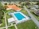 Resort-style community pool with surrounding lounge chairs at 9897 Se 178Th Pl, Summerfield, FL 34491